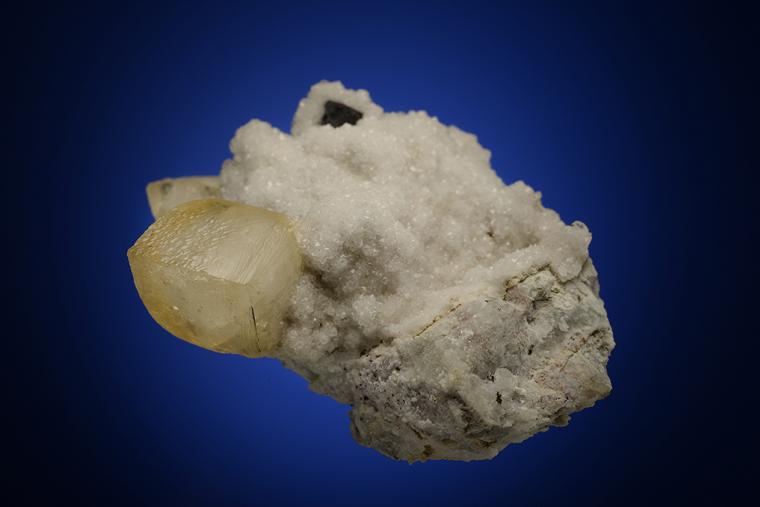 CALCITE with COPPER on ANALCIME